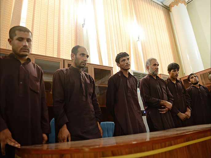 (From L to R) Afghans Safiullah, Nazar Mohammad, Qaisullah, Azizullah, Samiullah, Mustafa, and Jamil, the seven men who gang-raped four women on August 23, stand trial in court in Kabul on September 7, 2014. An Afghan judge on September 7 sentenced seven men to death for the gang-rape of four women in a case that has sparked nationwide outrage, with angry protests outside the court and proceedings broadcast live on television. The seven men, who stood in the dock dressed in brown traditional clothing, were found guilty of kidnapping and attacking the female members of a group that was driving into Kabul from a wedding. AFP PHOTO/SHAH Marai