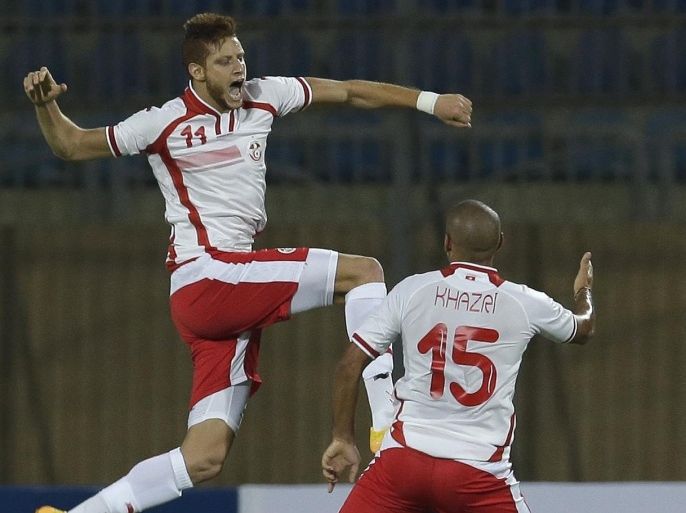 Tunisia's Fakhreddine Ben Youssef, left, celebrates scoring against Egypt with his teammate Wahbi Khazri during their Africa Cup of Nations group G qualifying soccer match in Cairo, Egypt, Wednesday, Sept. 10, 2014. The two other teams in group G are Senegal and Botswana. (AP Photo/Hassan Ammar)