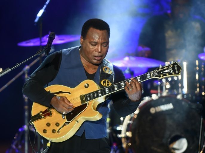 US guitarist, singer, and jazz composer, George Benson performs during the 50th session of the International Carthage Festival on July 16, 2014 at the Roman theater of Carthage near Tunis. AFP PHOTO / FETHI BELAID AFP PHOTO / FETHI BELAID