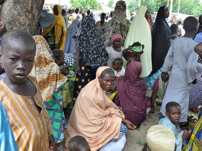 Civilians who fled their homes following an attacked by Islamist militants in Bama, take refuge at a School in Maiduguri, Nigeria, Wednesday, Sept. 3, 2014. A Nigerian senator says thousands of people are fleeing a northeastern city amid conflicting reports that it has been seized by Boko Haram Islamic militants. Sen. Ali Ndume said Tuesday the military is claiming it has repelled the insurgents in fierce fighting for the city of Bama but the stream of refugees indicates otherwise. (AP Photo/Jossy Ola)