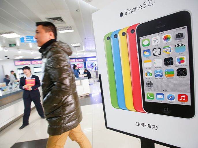 epa04025820 Advertisement for the new iPhone Five C is seen inside a China Mobile office during the launch of sales of iPhone smartphones in a tie up with China Mobile, the world's largest mobile operator, in Beijing, China, 17 January 2014. China mobile, the world's largest carrier with 760 million subscribers, partnered with Apple to sell iPhones, ending a six-year wait for its millions of customers. EPA