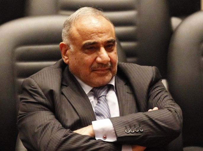 Iraq's new oil minister, Adel Abdel Mehdi, sits during a parliamentary session to vote on Iraq's new government at the parliament headquarters, in Baghdad September 8, 2014. Iraq's parliament approved a new government headed by Haider al-Abadi as prime minister on Monday night, in a bid to rescue Iraq from collapse, with sectarianism and Arab-Kurdish tensions on the rise. Picture taken September 8, 2014. REUTERS/Thaier Al-Sudani (IRAQ - Tags: CIVIL UNREST POLITICS ENERGY BUSINESS)