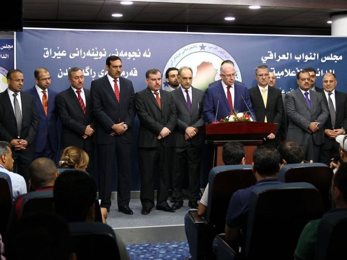 Former parliament speaker Osama al-Nujaifi (C) speaks during a press conference by members of Sunni political bloc Muttahidoon after the first session of the Iraqi Parliament, in Baghdad, Iraq, 01 July 2014. Iraqi lawmakers met briefly on 01 July for their first session since parliament was elected in April, but failed to agree on potential candidates for the parliament speaker position.