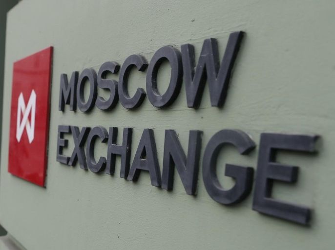 A woman walks out of the office of the Moscow Exchange in the capital Moscow August 1, 2014. Russia's largest lenders, Sberbank and VTB, are likely to lead a decline in Moscow shares on Friday after being hit by sanctions, with a slump in U.S. markets on global economy concerns and tensions with Russia also weighing. REUTERS/Maxim Shemetov (RUSSIA - Tags: BUSINESS POLITICS)