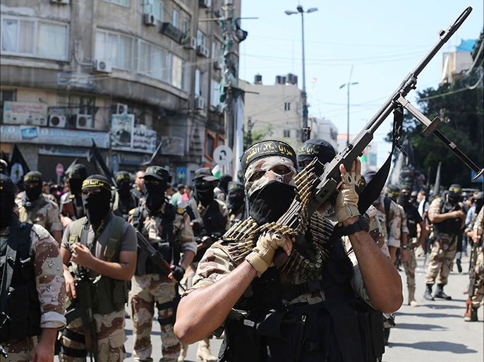 Palestinian Islamic Jihad militants take part in a rally celebrating what they say was a victory over Israel following a ceasefire in Gaza City August 29, 2014. An open-ended ceasefire, mediated by Egypt, took effect on Tuesday evening. It called for an indefinite halt to hostilities, the immediate opening of Gaza's blockaded crossings with Israel and Egypt, and a widening of the territory's fishing zone in the Mediterranean. Israel launched an offensive on July 8, with the declared aim of ending rocket fire into its territory. REUTERS/Ibraheem Abu Mustafa (GAZA - Tags: POLITICS CIVIL UNREST CONFLICT)