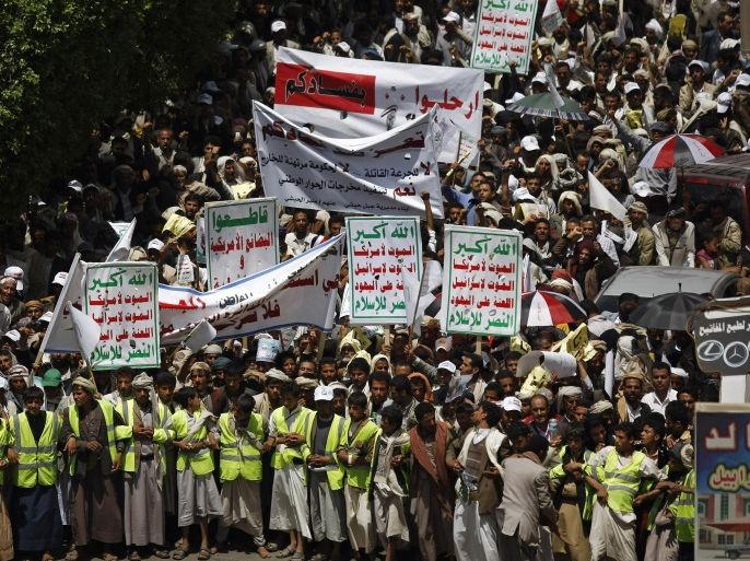 Protesters from the Shiite group known as the Hawthis chant anti-government slogans, during a demonstration blocking major roadways, demanding the reinstatement of fuel subsidies and the government to step down, in Sanaa, Yemen, Wednesday, Sept. 3, 2014. The disruption of traffic comes a day after Yemeni President Abed Rabbo Mansour Hadi dismissed the Cabinet and announced a reduction of fuel prices in an attempt to resolve the crisis. In addition to the Hawthi rebels, an al-Qaida branch in the south poses a major threat as it tries to impose control over cities and towns. Banners read, "Leave with your corruption." "Taiz city is against your corruption, no to fuel price hikes," and "Allah is the greatest, Death to America, Death to Israel, A curse on the Jews, Victory to Islam." (AP Photo/Hani Mohammed)