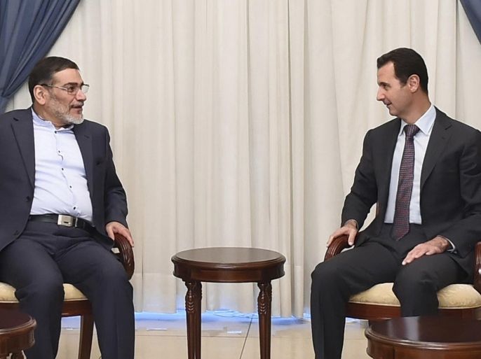 Syria's President Bashar al-Assad (R) meets Admiral Ali Shamkhani, Iran�s Supreme National Security Council Director, in Damascus September 30, 2014,in this picture released by Syria's national news agency SANA. REUTERS/SANA/Handout via Reuters (SYRIA - Tags: POLITICS) ATTENTION EDITORS - THIS PICTURE WAS PROVIDED BY A THIRD PARTY. REUTERS IS UNABLE TO INDEPENDENTLY VERIFY THE AUTHENTICITY, CONTENT, LOCATION OR DATE OF THIS IMAGE. FOR EDITORIAL USE ONLY. NOT FOR SALE FOR MARKETING OR ADVERTISING CAMPAIGNS. THIS PICTURE IS DISTRIBUTED EXACTLY AS RECEIVED BY REUTERS, AS A SERVICE TO CLIENTS