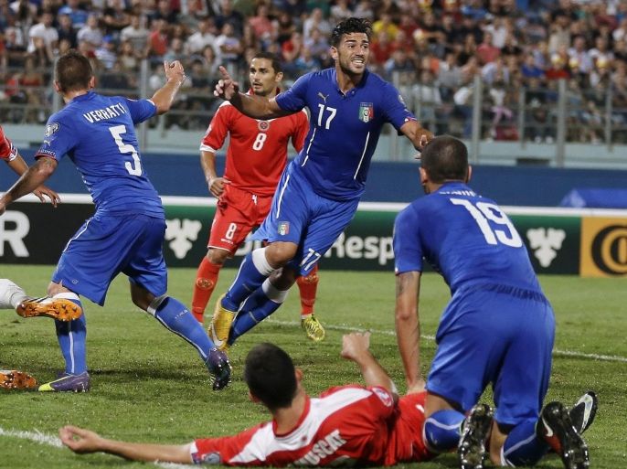 Italy’s Graziano Pelle, center, celebrates after scoring during the Euro 2016 qualifying soccer match between Malta and Italy, at the National Stadium Ta' Qali, in Valletta, Malta, Monday, Oct. 13, 2014. (AP Photo/Antonio Calanni)