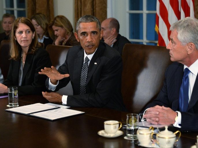 US President Barack Obama, with US Secretary of Defense Chuck Hagel (R) and Health and Human Services Secretary Sylvia Burwell (L), delivers remarks during a meeting with cabinet agencies coordinating the government's Ebola response in the Cabinet room of the White House in Washington, DC, USA 15 October 2014. President Obama canceled travel plans today to host the meeting today as news of a second health care worker was infected with the disease in Dallas, Texas.
