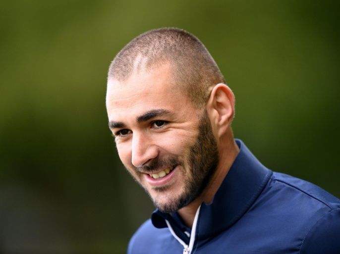 France's forward Karim Benzema arrives for a press conference in Clairefontaine-en-Yvelines on October 7, 2014 ahead of a friendly football match against Portugal to be held on October 11, 2014 at the Stade de France in Saint Denis, outside Paris. AFP PHOTO / FRANCK FIFE