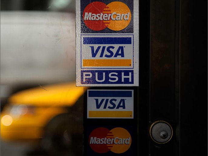 epa03165730 The Visa and Mastercard logo are displayed in store fronts in New York City, New York, USA, 30 March, 2012. Law enforcement officials are investigating what appears to be a massive theft of U.S. consumers' credit card data, MasterCard and Visa confirmed Friday. The computer security expert who first reported the theft said it might involve as many as 10 million MasterCard and Visa accounts, making it one of the largest known credit card heists. EPA/PETER FOLEY EPA/PETER FOLEY