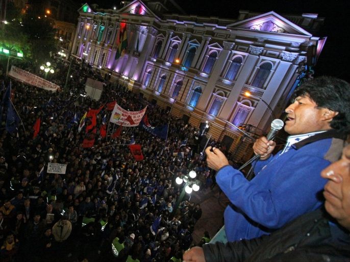 Bolivian president Evo Morales (R) celebrates his victory in the presidential elections, at the Government Palace, in La Paz, Bolivia, 12 October 2014. Bolivian President Evo Morales claimed a landslide victory in the presidential elections after exit polls showed him with a commanding lead. Exit polls showed the left-wing populist Morales winning a third term in office with more than 60 percent of the votes. Centre-right candidate Samuel Doria Medina was polling second, with 24 percent of the votes, and he conceded defeat.