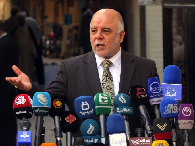 Iraqi Prime Minister Haider al-Abadi speaks to reporters after a meeting with the top Shiite cleric, Grand Ayatollah Ali al-Sistani, in the Shiite holy city of Najaf, south of Baghdad, October 20, 2014. REUTERS/Alaa Al-Marjani (IRAQ - Tags: POLITICS RELIGION)