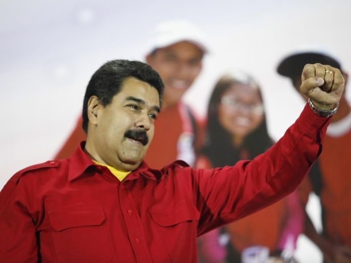 Venezuela's President Nicolas Maduro gestures during a meeting with supporters in Caracas, in this handout photo provided by Miraflores Palace October 11, 2014. REUTERS/Miraflores Palace/Handout via Reuters (VENEZUELA - Tags: POLITICS) ATTENTION EDITORS - THIS PICTURE WAS PROVIDED BY A THIRD PARTY. REUTERS IS UNABLE TO INDEPENDENTLY VERIFY THE AUTHENTICITY, CONTENT, LOCATION OR DATE OF THIS IMAGE. THIS PICTURE IS DISTRIBUTED EXACTLY AS RECEIVED BY REUTERS, AS A SERVICE TO CLIENTS.FOR EDITORIAL USE ONLY. NOT FOR SALE FOR MARKETING OR ADVERTISING CAMPAIGNS
