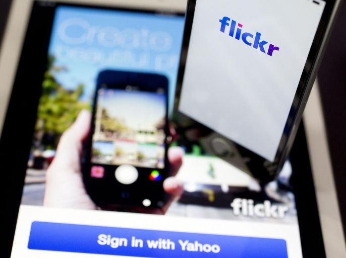 Yahoo! Inc.'s Flickr application is displayed on an Apple Inc. iPhone 5s and iPad Air in this arranged photograph in Washington, D.C., U.S., on Tuesday, April 15, 2014. Yahoo! Inc. expected to release earnings figures after the market close on April 15.