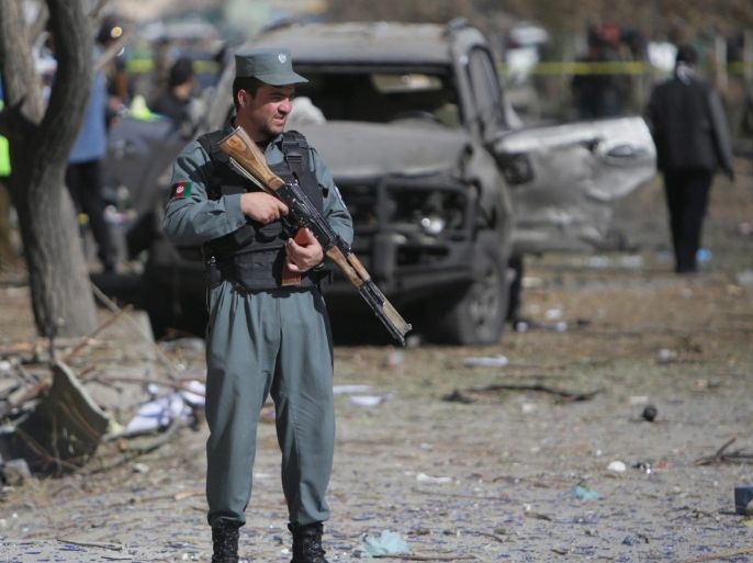 Afghan security officials inspect the scene of a suicide car bomb attack that targeted a female legislator Shukria Barakzai in Kabul, Afghanistan, 17 November 2014. At least three people were killed on 17 November while dozens including Shukria Barakzai were injured when a suicide bomber targeted her car near the Afghan parliament building, security officials said.