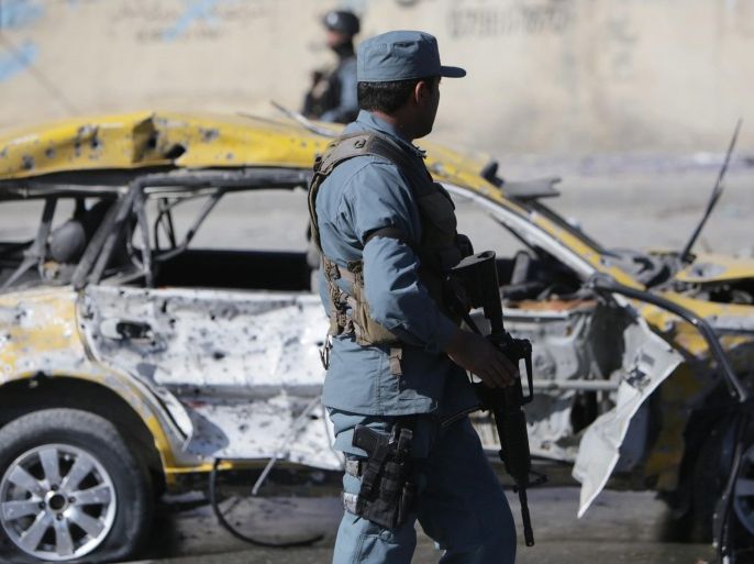 Afghan security officials inspect the scene of a suicide car bomb attack that targeted a female legislator Shukria Barakzai in Kabul, Afghanistan, 17 November 2014. At least three people were killed on 17 November while dozens including Shukria Barakzai were injured when a suicide bomber targeted her car near the Afghan parliament building, security officials said.