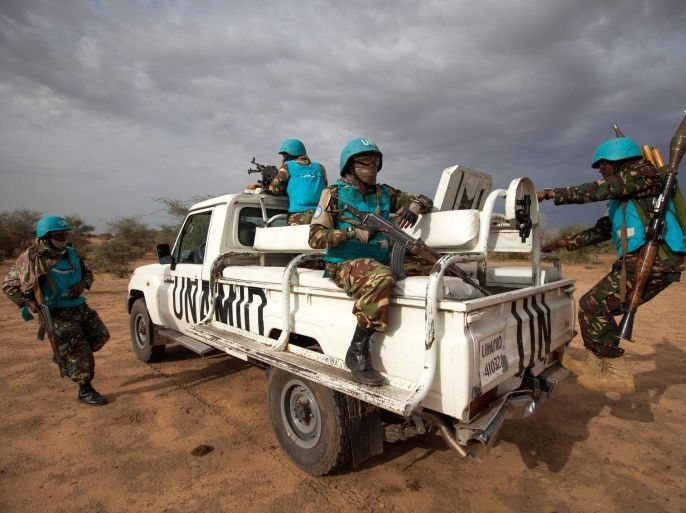 A handout photograph made available on 02 July 2014 by the African Union â United Nations Mission in Darfur (UNAMID) shows UNAMID troops from Tanzania, deployed in Khor Abeche, South Darfur, conducting a routine patrol in Karbab village, where the community reported threats by other tribes, Sudan, 01 July 2014. UNAMID reinforced the number of patrols in villages around Khor Abeche, where on March 22 over 300 heavily armed men set fire to dozens of shelters in a camp for displaced people and stole livestock belonging to the residents. EPA/ALBERT GONZALEZ FARRAN / UNAMID / HANDOUT