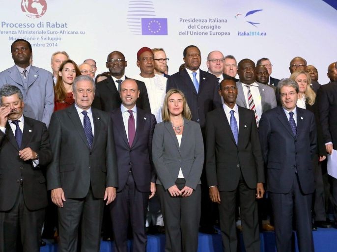Federica Mogherini (C, front row), the EU High Representative for Foreign Affairs and Security Policy, Senegal's Interior Minister Abdoulaye Daouda Diallo (2-R, front row) and Italy's Foreign Minister Paolo Gentiloni Silveri (R, front row) along with other unidentified participants pose for a group photo at the end of the press conferences of the Euro-African Meeting about the 'Process of Rabat' in Rome, 27 November 2014.