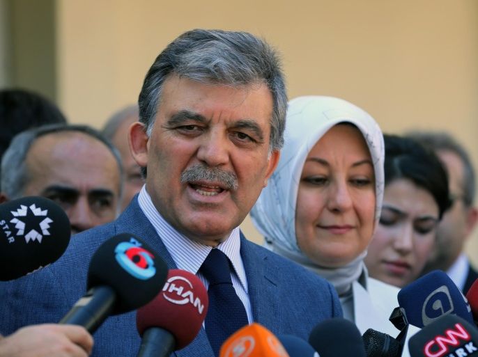 Turkey's President Abdullah Gul speaks to the media with his wife Hayrunnisa Gul after they have cast their votes for the Turkey's presidential election at a polling station in Ankara, Turkey, on Sunday, Aug. 10, 2014. Turks were voting in their first direct presidential election Sunday - a watershed event in Turkey’s 91-year history, where the president was previously elected by Parliament. Prime Minister RecepTayyip Erdogan, who has dominated the country’s politics for the past decade, is the strong front-runner to replace the incumbent, Abdullah Gul, for a five-year term. (AP Photo/Burhan Ozbilici)