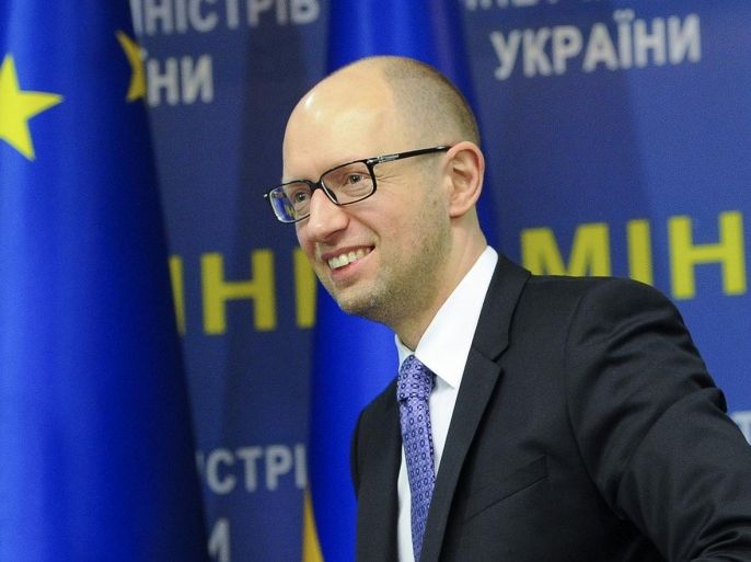 Ukraine's Prime Minister Arseniy Yatsenyuk smiles during a press conference in Kiev, Ukraine, Wednesday, Oct. 29, 2014. The pro-European political parties, including Yatsenyuk's Popular Front, that secured most votes in Sunday's parliamentary elections are negotiating to form a coalition government. (AP Photo/Andrew Kravchenko, Pool)