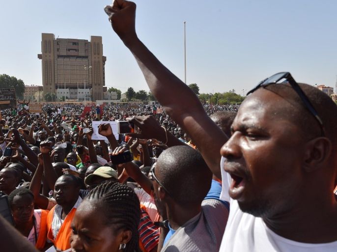 An opposition supporters shouts during a protest at the Place de la Nation in Burkina Faso's capital Ouagadougou, on November 2, 2014, calling for the departure of the military. UN envoy for west Africa, Mohamed Ibn Chambas called for a civilian transition in Burkina Faso after the ouster of president Blaise Compaore, threatening sanctions if the military holds on to power in the west African country. AFP PHOTO / ISSOUF SANOGO
