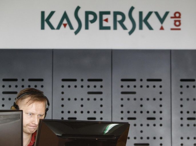 An employee works near screens in the virus lab at the headquarters of Russian cyber security company Kaspersky Labs in Moscow July 29, 2013. Security researchers at Kaspersky Lab said they have uncovered a cyber espionage operation that successfully penetrated two spy agencies and hundreds of government and military targets in Europe and the Middle East since the beginning of this year. REUTERS/Sergei Karpukhin/Files (RUSSIA - Tags: SCIENCE TECHNOLOGY CRIME LAW BUSINESS)
