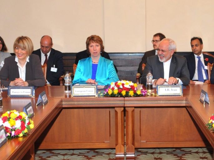 Iranian Mohammad Javad Zarif (C-R) sits next to European Union Catherine Ashton (C-L), during their meeting in the framework of negotiations on the Iranian nuclear file in Muscat, Oman, 11 November 2014. The delegates and experts of six nations and Iran are trying to clinch a deal by a November 24 deadline that would curb Tehran's nuclear programme in return for the lifting of economic sanctions.