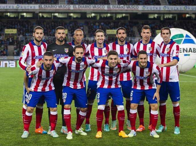 SAN SEBASTIAN, SPAIN - NOVEMBER 09: Atletico de Madrid players line up for a team photo prior to the start of the La Liga match between Real Sociedad and Atletico de Madrid at Estadio Anoeta on November 9, 2014 in San Sebastian, Spain.
