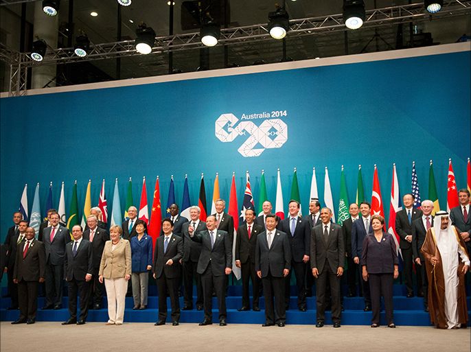 epa04490346 World leaders gather for a family photograph during the G20 summit at the Brisbane Convention and Exhibitions Centre (BCEC) in Brisbane, Australia 15 November 2014. The G20 summit will be held in Brisbane on 15 and 16 November. The G20 represents 90 percent of global gross domestic product, two-thirds of the world's people and four-fifths of international trade