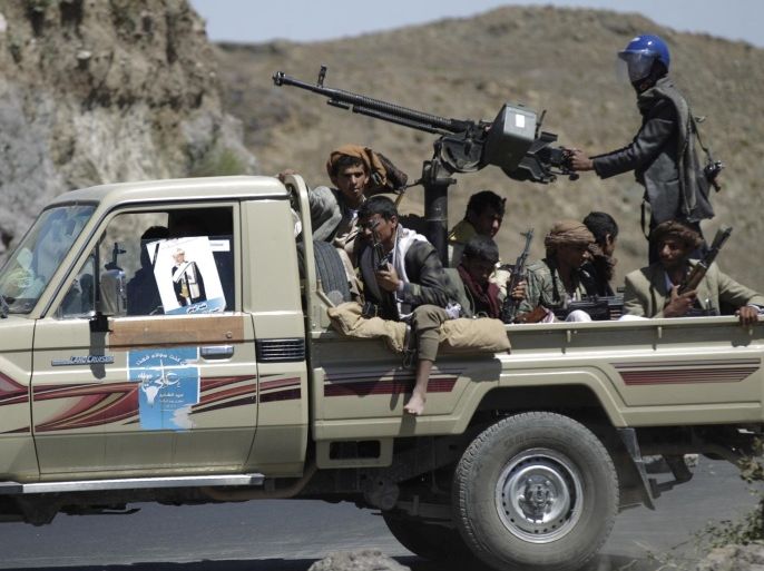 Shi'ite Houthi rebels ride a patrol truck in Yareem town of Yemen's central province of Ibb October 22, 2014. Houthi fighters clashed with supporters of the Sunni Muslim Islah party in Yareem, earlier this week, residents and local officials said, raising the spectre of a wider sectarian confrontation in the country, which shares a long border with the world's top oil exporter, Saudi Arabia. REUTERS/Khaled Abdullah (YEMEN - Tags: POLITICS CIVIL UNREST)