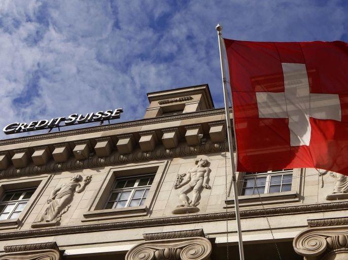 A national flag of Switzerland flies in front of a branch office of Swiss bank Credit Suisse in Luzern October 30, 2014. Credit Suisse said on Friday it added a net 390 million Swiss francs ($406 million) to its litigation provisions in the third quarter. Picture taken on October 30, 2014. REUTERS/Arnd Wiegmann (SWITZERLAND - Tags: BUSINESS LOGO)