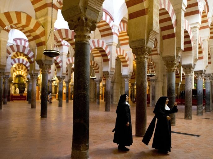 Nuns visit the Mosque-Cathedral of Cordoba on October 14, 2014. Historical treasure and UNESCO World Heritage Site, the Mosque-Cathedral of Cordoba is the subject of a dispute over its ownership. AFP PHOTO/ GERARD JULIEN