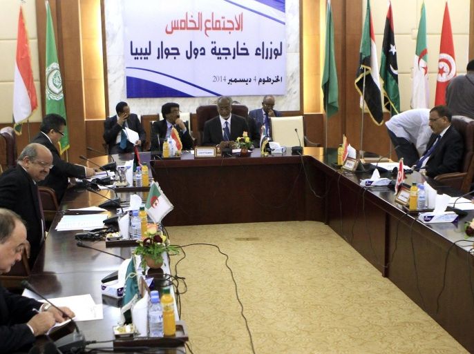 Sudanese Foreign Minister Ali Ahmed Karti (C) chairs a meeting of high-level representatives from countries neighbouring Libya aimed at finding a solution to the conflict in the North African country, on December 4, 2014 in Khartoum. AFP PHOTO/ASHRAF SHAZLY