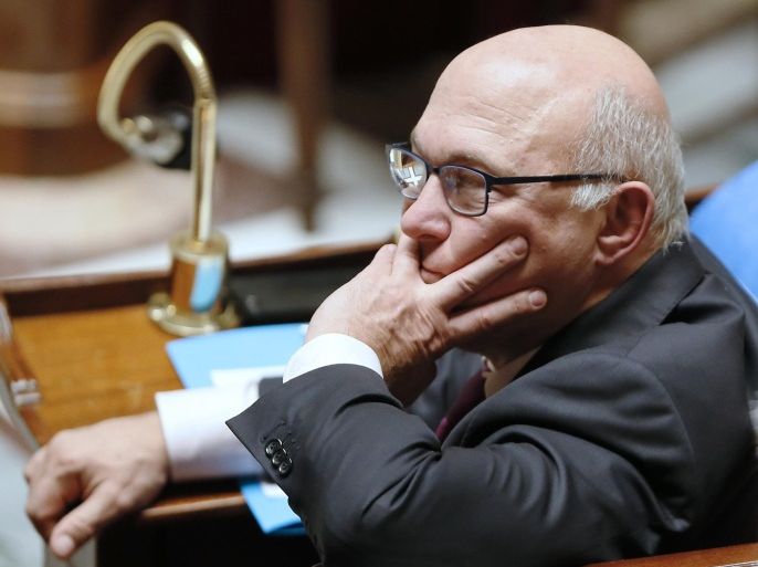 French Finance minister Michel Sapin takes part in a weekly session of Questions to the Government, on December 10, 2014 at the French National Assembly in Paris. AFP PHOTO PATRICK KOVARIK