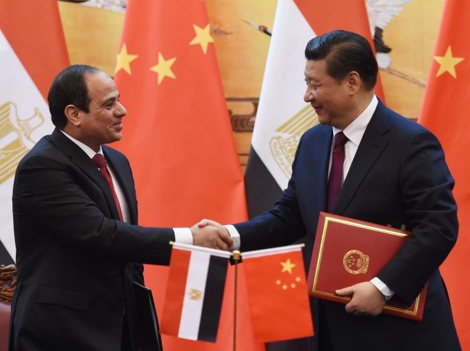 BEIJING, CHINA - DECEMBER 23: Egypt's President Abdel Fattah al-Sisi (L) greets Chinese President Xi Jinping (R) during a signing ceremony at the Great Hall of the People on December 23, 2014 in Beijing, China. President Abdel Fattah al-Sisi is undertaking his first visit to China in hopes to secure investment deals.