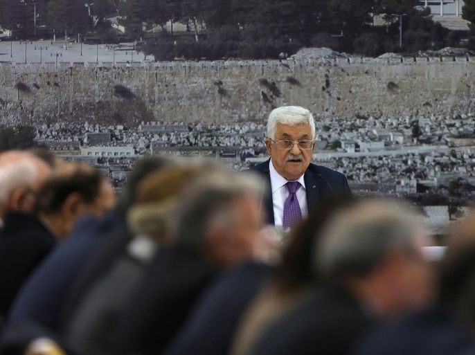 Palestinian president Mahmud Abbas speaks during a meeting with Palestinian leaders on December 18, 2014, in the West Bank city of Ramallah. The Palestinians presented a draft UN resolution laying out terms for a final peace deal with Israel but sought to avoid a clash with the United States by saying they were open to negotiations on the text. AFP PHOTO/ ABBAS MOMANI