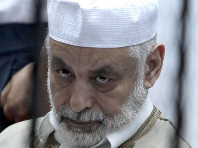 Former Libyan Prime Minister Baghdadi al-Mahmoudi looks on as he sits behind bars in a cage during the first day of his trial, at a courthouse in Tripoli, Libya, 12 November 2012. Al-Mahmoudi faces charges of involvement in crimes under the Gaddafi rule, which was toppled last year. He served as prime minister from 2006 until August 2011, when he fled to Tunisia after insurgents seized control of Tripoli, virtually ending Gaddafis 42-year rule. Tunisia extradited al-Mahmoudi to Libya in June 2012.