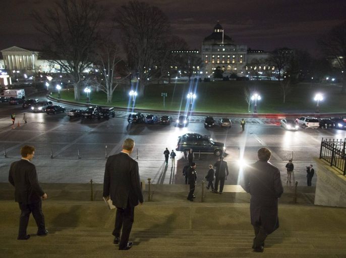 Members of the U.S. Congress depart after passage of a spending bill on the House floor at the U.S. Capitol in Washington December 11, 2014. The U.S. House of Representatives passed a $1.1 trillion spending bill late on Thursday to fund most federal agencies through Sept. 30, the end of the current fiscal year. By a vote of 219-206, the House approved the bill, which would fund the Department of Homeland Security only through February to give Republicans a chance early next year to try to stop President Barack Obama's immigration reforms that are largely carried out by DHS. REUTERS/Jonathan Ernst (UNITED STATES - Tags: POLITICS BUSINESS)