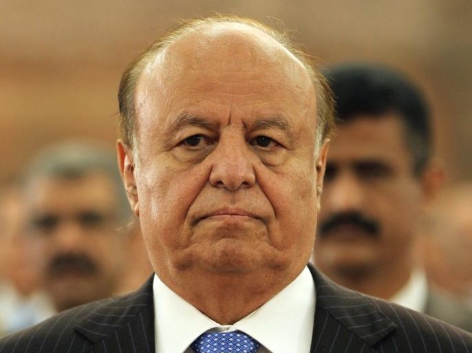 Yemeni President Abd Rabbo Mansour Hadi stands during the playing of the national anthem at a ceremony commemorating the first anniversary of the signing of Yemen's power transfer deal in the capital Sanaa, on November19, 2012. Yemeni President Abdrabuh Mansur Hadi stressed his commitment to ensuring the success of the political transition in his country, during a speech in Sanaa attended by UN chief Ban Ki-moon.
