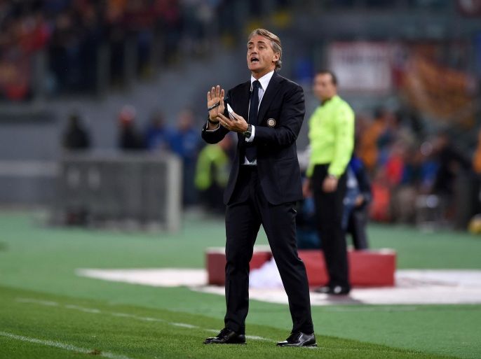 ROME, ITALY - NOVEMBER 30: Head coach FC Internazionale Roberto Mancini reacts during the Serie A match between AS Roma and FC Internazionale Milano at Stadio Olimpico on November 30, 2014 in Rome, Italy.