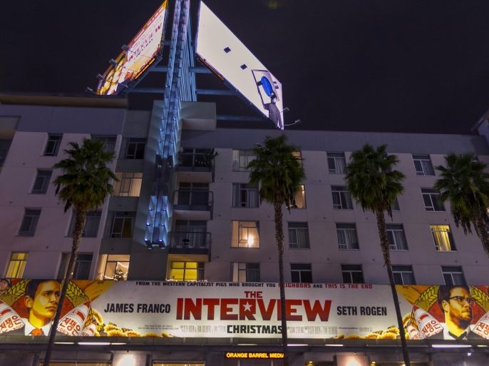 A banner for "The Interview" hangs at Arclight Cinemas, Wednesday, Dec. 17, 2014, in the Hollywood section of Los Angeles. A U.S. official says North Korea perpetrated the unprecedented act of cyberwarfare against Sony Pictures that exposed tens of thousands of sensitive documents and escalated to threats of terrorist attacks that ultimately drove the studio to cancel all release plans for the film at the heart of the attack, "The Interview." (AP Photo/Damian Dovarganes)
