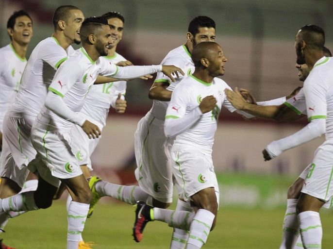 Algeria's Yacine Brahimi (C) celebrates with team mates after scoring against Malawi during their African Nations Cup qualifying soccer match at Tchaker Stadium in Blida October 15, 2014. REUTERS/Louafi Larbi (ALGERIA - Tags :SPORT SOCCER)