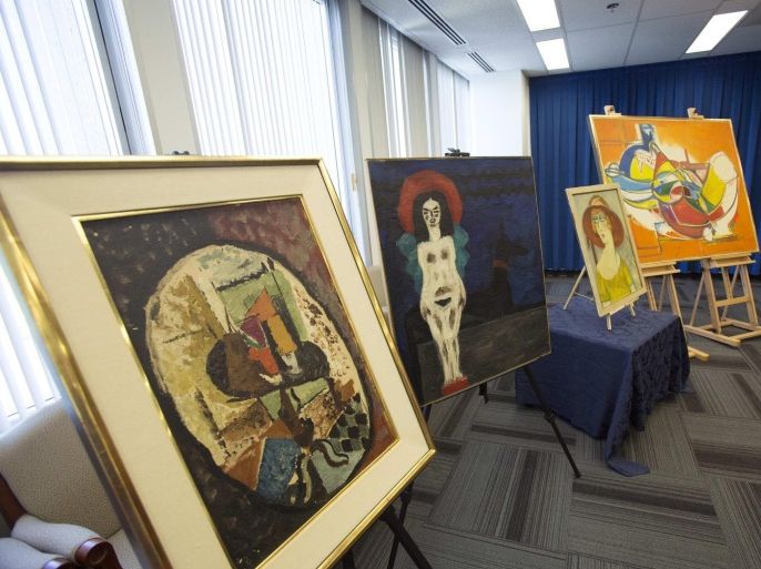 Recovered paintings are pictured during a news conference at FBI Headquarters in Los Angeles, California December 19, 2014. Federal agents and police in Los Angeles have recovered nine paintings worth millions of dollars that were stolen from the home of an elderly couple six years ago, including works by Marc Chagall and Diego Rivera, and FBI spokeswoman said on Wednesday. REUTERS/Mario Anzuoni (UNITED STATES - Tags: CRIME LAW ENTERTAINMENT)