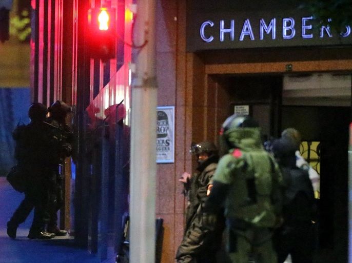 SYDNEY, AUSTRALIA - DECEMBER 16: Police enter the Lindt Chocolate Cafe, Martin Place during a hostage standoff on December 16, 2014 in Sydney, Australia. Police stormed the Sydney cafe as a gunman had been holding hostages for 16 hours.