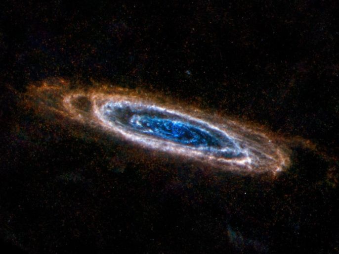 A undated handout image made available by NASA 30 January 2013, showing the ring-like swirls of dust filling the Andromeda galaxy standing out colourfully in an image from the Herschel Space Observatory, a European Space Agency mission with important NASA participation. The glow seen here comes from the longer-wavelength, or far, end of the infrared spectrum, giving astronomers the chance to identify the very coldest dust in our galactic neighbour These light wavelengths span from 250 to 500 microns, which are a quarter to half of a millimetre in size. Herschel's ability to detect the light allows astronomers to see clouds of dust at temperatures of only a few tens of degrees above absolute zero. These clouds are dark and opaque at shorter wavelengths. The Herschel view also highlights spokes of dust between the concentric rings. EPA/ESA / NASA / JPL-Caltech / NHSC