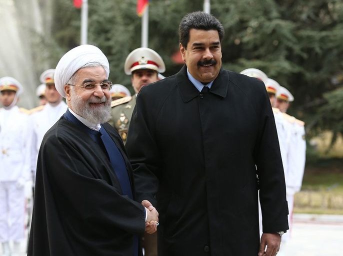TEHRAN, IRAN - JANUARY 10 : Iranian President Hassan Rouhani (L) shakes hand with Venezuelan President Nicolas Maduro (R) after reviewing an honor guard at the Saadabad Palace in Tehran, Iran on January 10, 2015.