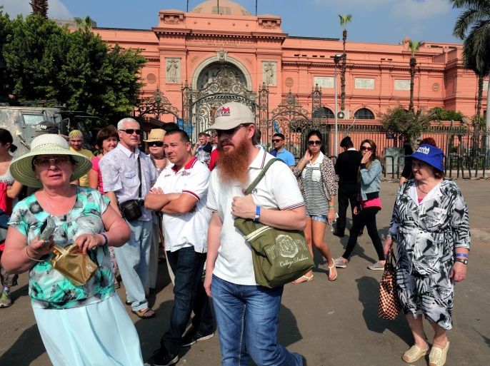 A group of tourists walk outside the Egyptian Museum at Tahrir square in Cairo, Egypt, 20 November 2014. Tourism used to be a major foreign currency earner for Egypt, however the industry was blighted by the political turmoil that gripped Egypt in the wake of the 2011 popular uprising. The situation got worse as violence increased after the army's overthrow of Mohammed Morsi in mid-2013, but in recent months, some countries have cancelled their travel warnings against visiting Egypt.