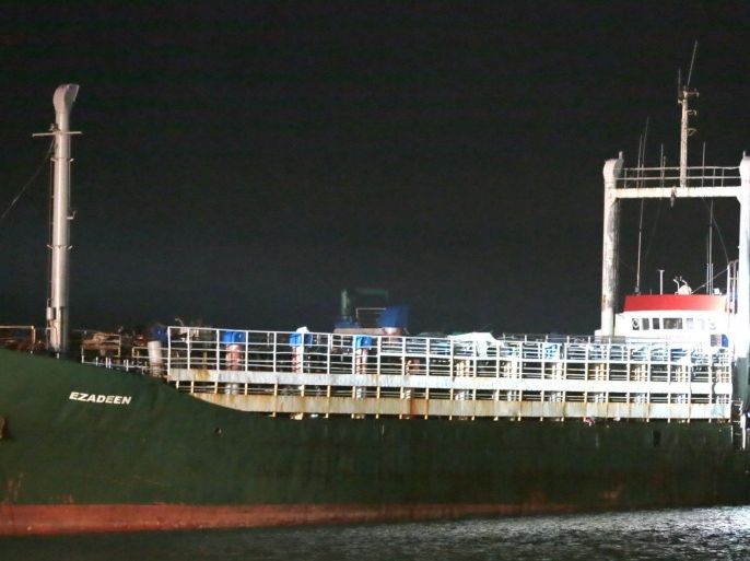 The cargo ship Ezadeen, carrying hundreds of migrants, arrives at the southern Italian port of Corigliano, Italy, late Friday, Jan. 2, 2015. The cargo ship was stopped with about 450 migrants aboard after smugglers sent it speeding toward the coast in rough seas with no one in command. Italian authorities lowered engineers and electricians onto the wave-tossed ship by helicopter to secure it, and the Icelandic Coast Guard towed it to the Italian port of Corigliano late Friday night. Smugglers who bring migrants to Europe by sea appear to have adopted a new, more dangerous tactic: cramming hundreds of them onto a large cargo ship, setting it on an automated course to crash into the coast, and then abandoning the helm. (AP Photo/Antonino D'Urso)