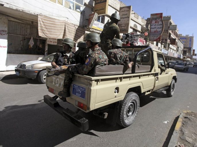 Security forces ride a truck as they proceed to the main entrance leading to the headquarters of the French embassy during a demonstration against satirical French weekly Charlie Hebdo, which featured a cartoon of the Prophet Mohammad as the cover of its first edition since an attack by Islamist gunmen, in Sanaa January 17, 2015. REUTERS/Mohamed al-Sayaghi (YEMEN - Tags: CIVIL UNREST)